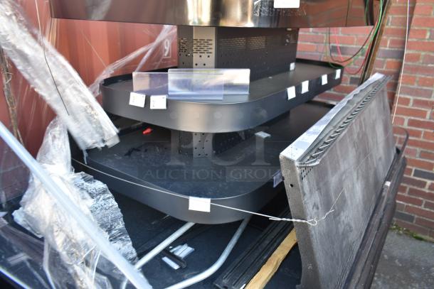 Commercial Island Style Grab N Go Merchandiser, black shelves, perforated metal frame, new condition, protective wrapping.