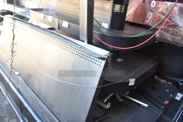 Commercial Island Style Grab N Go Merchandiser, black metal, multiple shelves, used condition, some wiring visible.