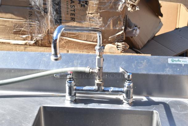 Commercial counter with sink bay and drawer, stainless steel, includes Marlo Mfg. Co. label. Condition appears used.