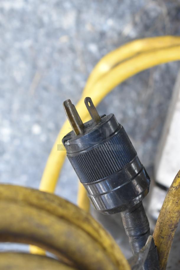 Close-up of the power plug for a Hercules 175 RPM Commercial Floor Cleaner, highlighting the durable black and yellow cable.