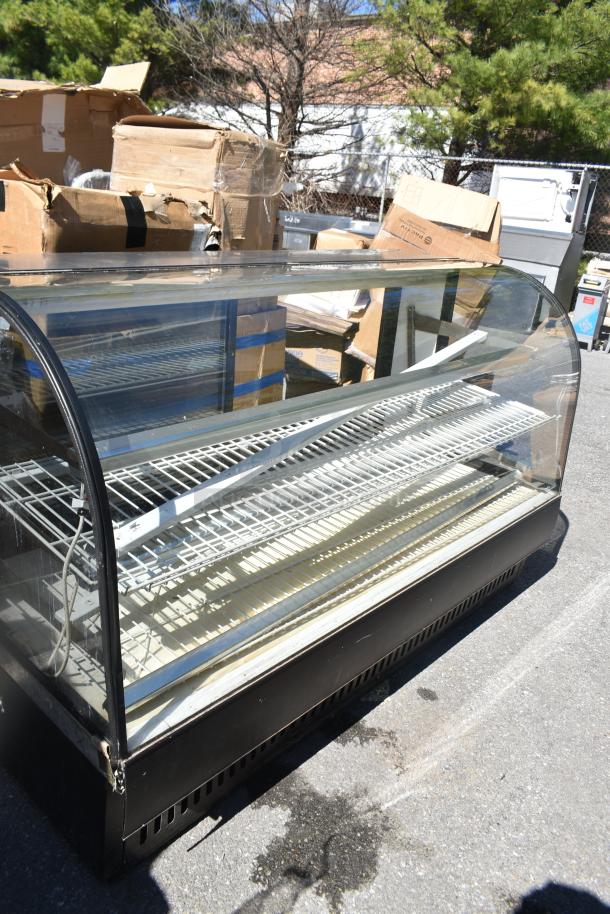 True TCGD-77 commercial dry display case merchandiser, glass front, shelving inside, 115 volts, 1 phase, good condition.