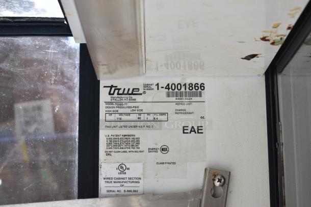True TCGD-77 Commercial Dry Display Case Merchandiser label showing model, voltage, and serial number.