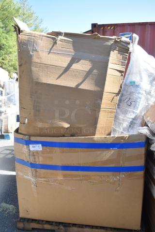 Cardboard box containing 6 brand new scratch and dent items, including a ban rack and mop sink. Blue tape and label visible.