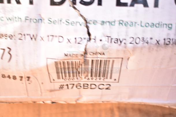 Close-up of a damaged box label showing dimensions, barcode, and "Made in China" text. Box shows wear and tear.