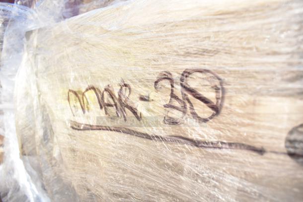 12 new scratch and dent items wrapped in plastic, labeled "MAR-30." Includes table, strainer basket, and sink.