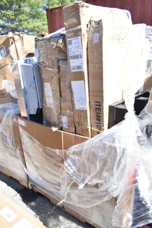 Boxes of scratch and dent items including a pan rack, platform truck, and rack cart, sealed with plastic wrap; new condition.