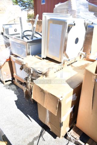 45 brand new scratch and dent items including a sink and ice bin, stacked on pallets, some in damaged boxes.