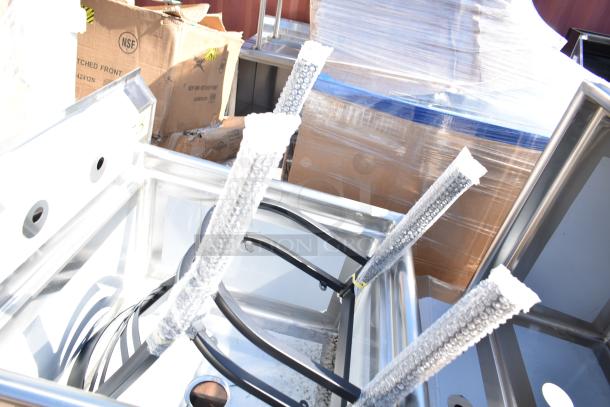 Brand new scratch and dent items, including a stainless steel sink and ice bin. Packaged and ready for auction.