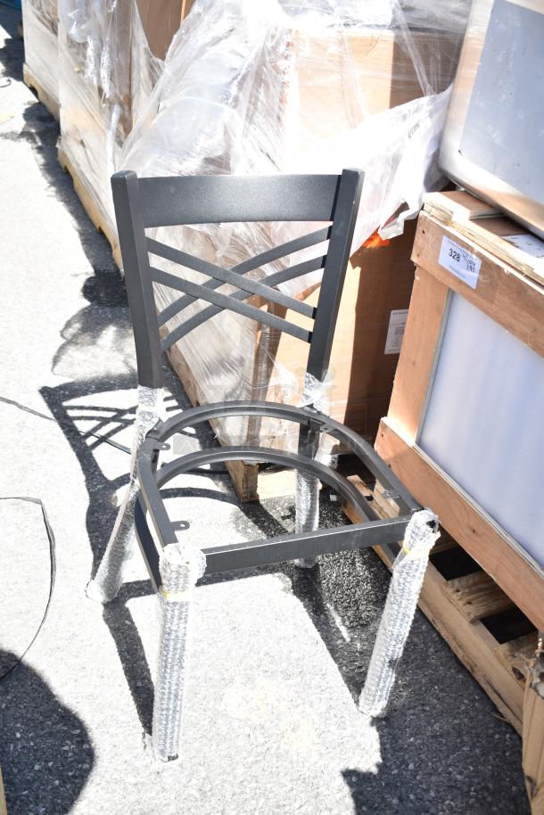 Stacked metal chairs with protective wrap on legs, visible tags, part of a 45-piece scratch and dent auction lot.