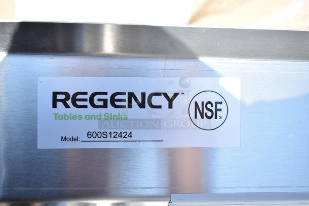 Regency Tables and Sinks label, NSF certified, Model 600S12424. Appears on stainless steel surface.