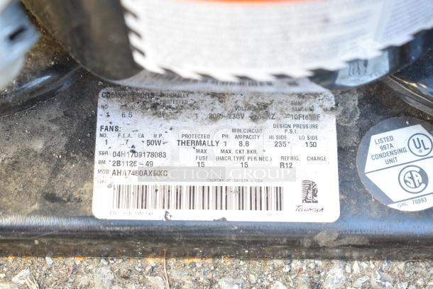 Tecumseh compressor label showing 208-230V, 1 Phase, R12 refrigerant, model AH74760AXBXC, made in USA, UL listed.