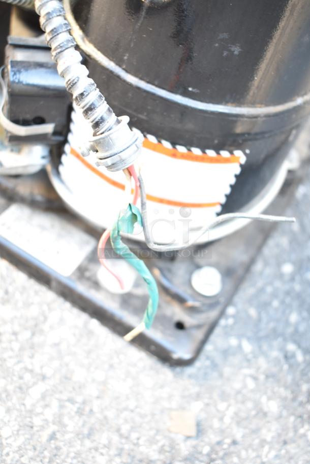 Two Tecumseh compressors, 208-230V, 1 phase. Wiring visible. Good condition. Auction: 2 for 1 bid deal.