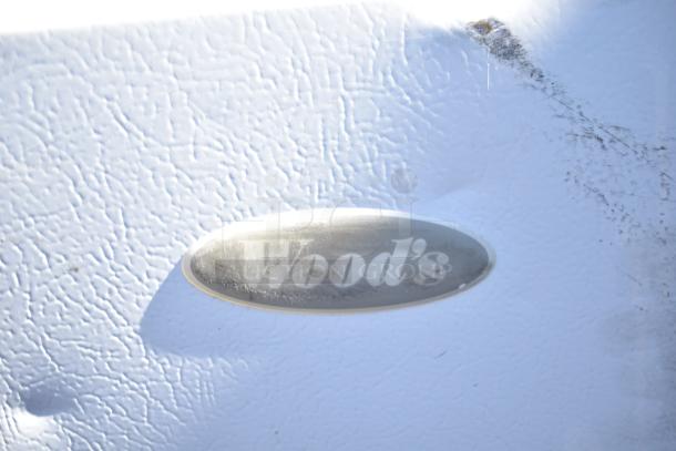 Wood's V07NAA Single Door Reach In Freezer with visible brand label, textured surface, runs on 115 Volts, 1 Phase.