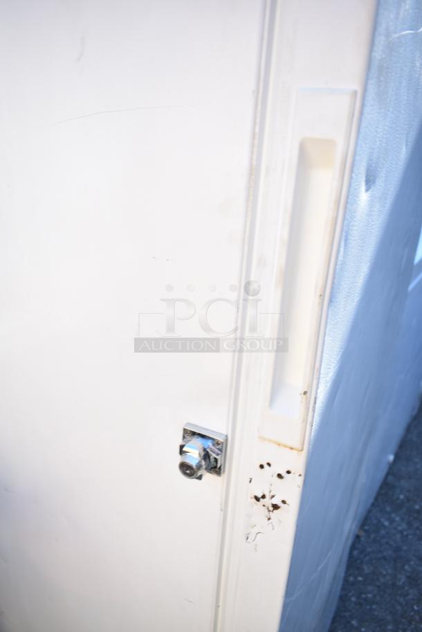 Wood's V07NAA Single Door Reach In Freezer, visible lock, some surface blemishes, 115 Volts, 1 Phase.