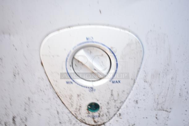 Control dial of the FFCW9NKRW chest freezer, showing settings from MIN to MAX. Dial shows signs of wear.