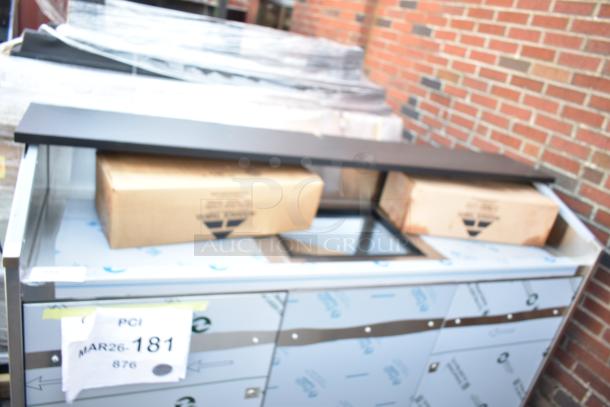 BRAND NEW SCRATCH AND DENT Advance Tabco AMD-6B 74" portable bar with stainless steel doors, interior, visible boxes.