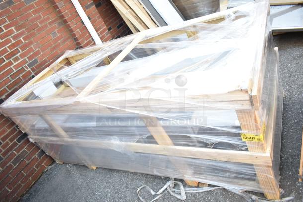 Brand new Regency 600S31824218 3 Bowl Sink, packaged, visible scratch and dent, wrapped in plastic and wood frame.