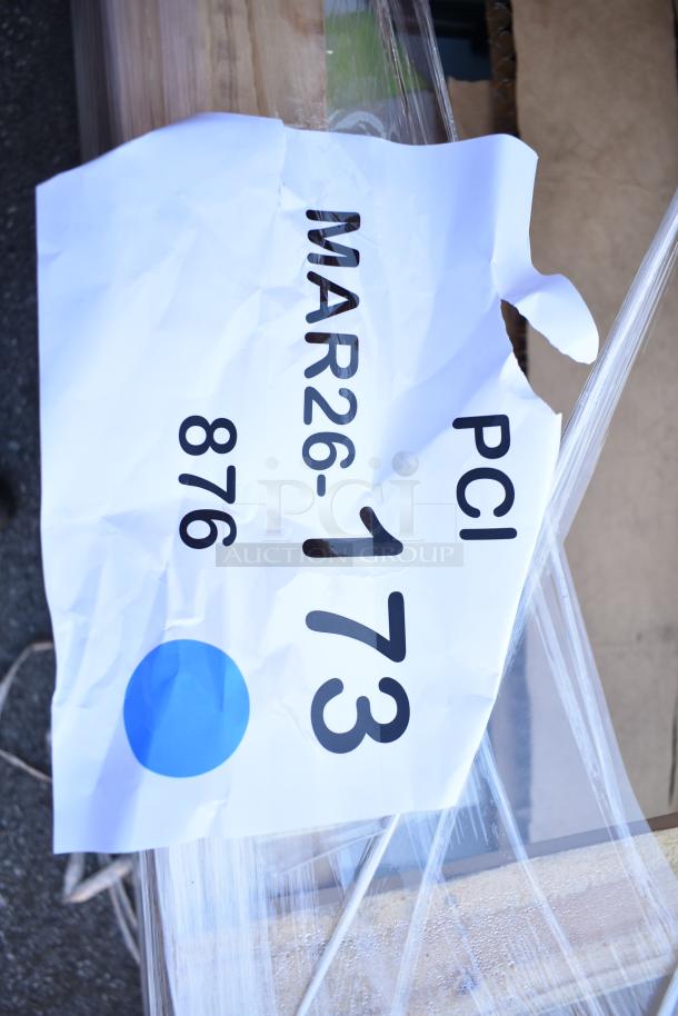 Crumpled paper label with "MAR26-173 PCI 876" and blue dot, indicating a Regency 600S31824218 3 Bowl Sink, scratch and dent condition.