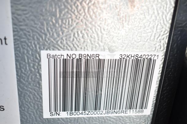 Label on metal surface with barcode, "Batch NO B9N6R," and serial number "1B0045Z0002JB9N6RE11588."