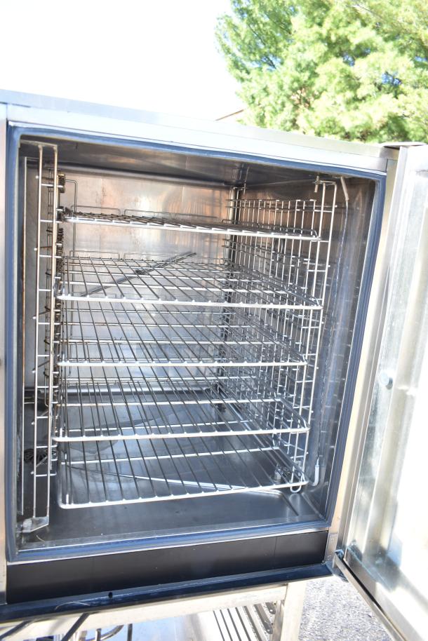 Electrolux Air-o-convect Touchline 9F92225200 commercial convection oven on stand with casters, open door view showing racks.