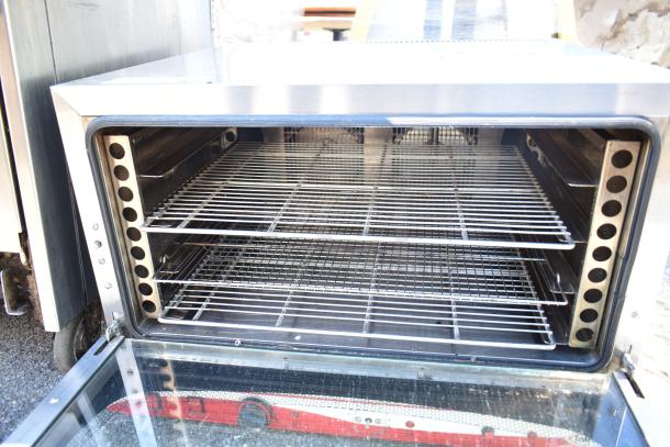 Empero EMP.PFE4-U commercial countertop convection oven, stainless steel, 208 volts, three racks, clean condition.