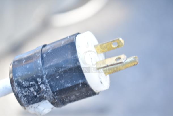 Power plug of Empero EMP.PFE4-U commercial countertop convection oven, 208 volts. Condition shows wear, tarnished prongs.