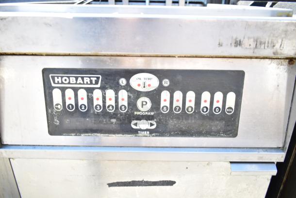 Hobart 1HF85C commercial fryer control panel, features programmable settings, oil temperature display; shows some wear.