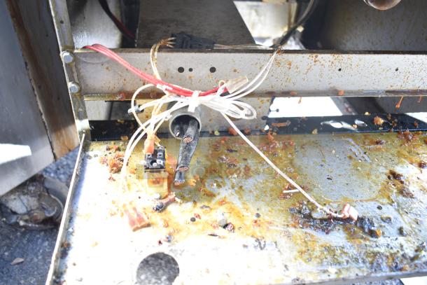 Hobart 1HF85C commercial fryer interior with exposed wiring and grease buildup, indicating need for maintenance.