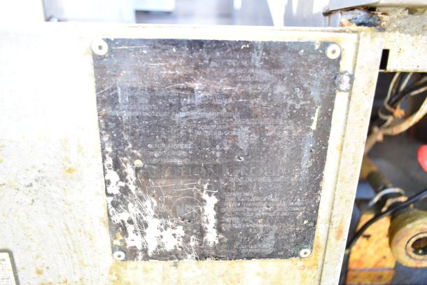 Hobart 1HF85C commercial deep fat fryer with visible metal plate, worn condition. Model and safety details inscribed.