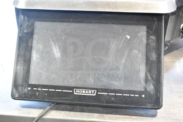 2017 Hobart HTi-7LH26 food portioning scale, commercial countertop model, shows surface wear. Does not power on.