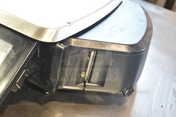 2017 Hobart HTi-7LH26 commercial countertop food portioning scale, black and stainless steel, non-functional, visible wiring.