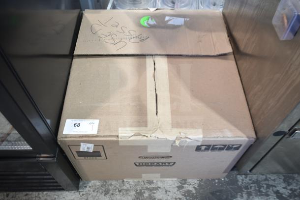 Cardboard box containing a 2017 Hobart HTi-7LH26 commercial food scale. Marked "Used" with handling labels. Box shows wear.