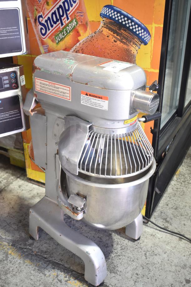 Thunderbird ARM-02 Commercial 20 Quart Planetary Dough Mixer with mixing bowl and bowl guard. Visible wear, 115 volts, 1 phase.