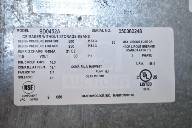 Manitowoc SD0452A Ice Machine on SPA310 Dispenser, 115V, 1 Phase. Model label details power, refrigerant, and serial info.