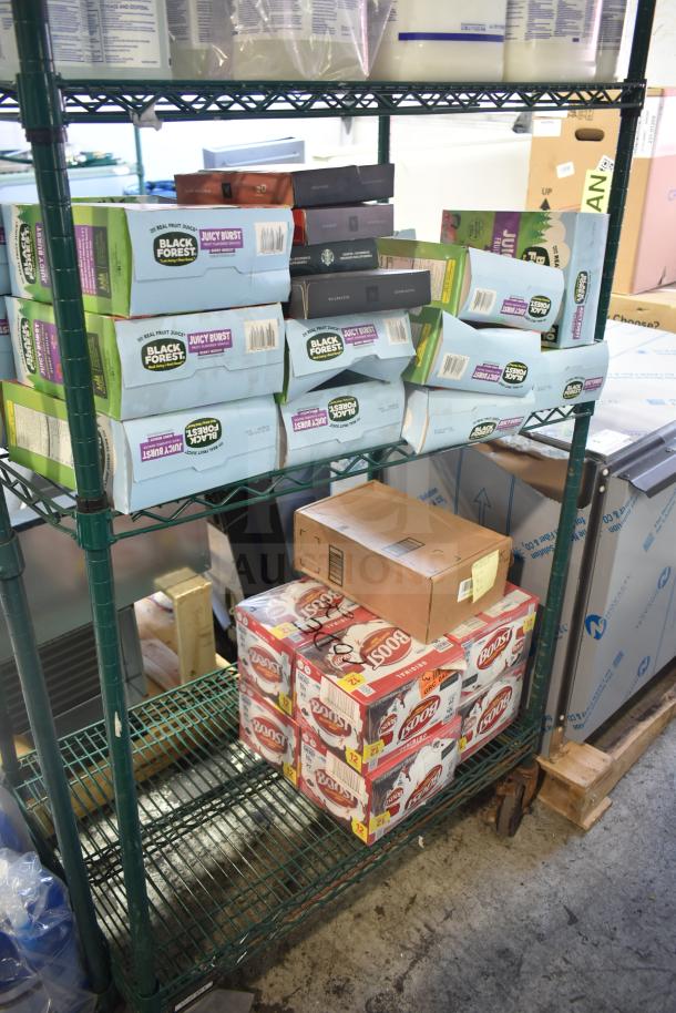 Two-tier metal shelving with Black Forest gummies and Boost drinks. Assorted boxes include ballet flat shoes. Mixed condition.