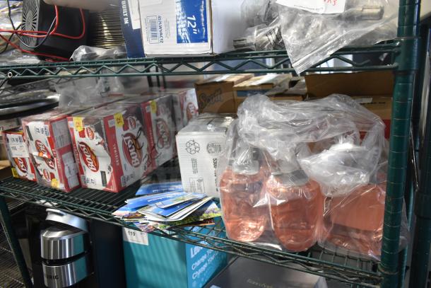 Tiered shelf with Boost drinks, GoJo Luxury Foam Handwash, and various sealed items. Items appear in original packaging.