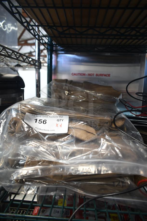 Packaged Lancaster Table & Seating 9' Round Clay Brown Umbrella Canopies, new condition, labeled 156, quantity 4.