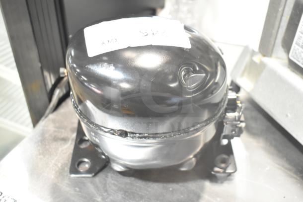 Brand new Cubigel NUT70NR motor, 115-127V, 1 phase, with scratch and dent. Compact design.