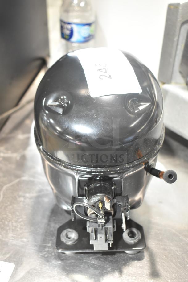 Brand new Cubigel NUT70NR motor, 115-127V, 1 phase; visible scratches and dents, features label showing number 246.