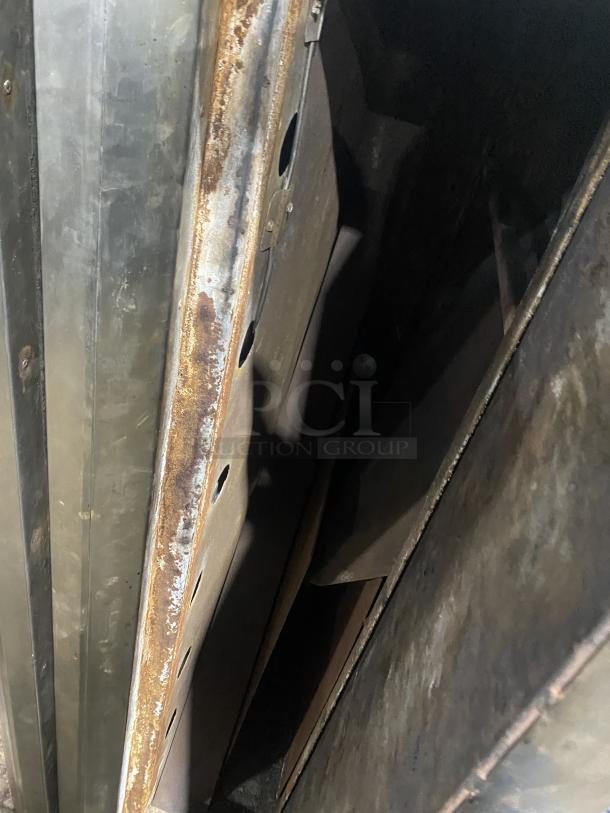 Commercial stainless steel double-stacked gas convection oven, Model 648 M, showing interior condition and wear.