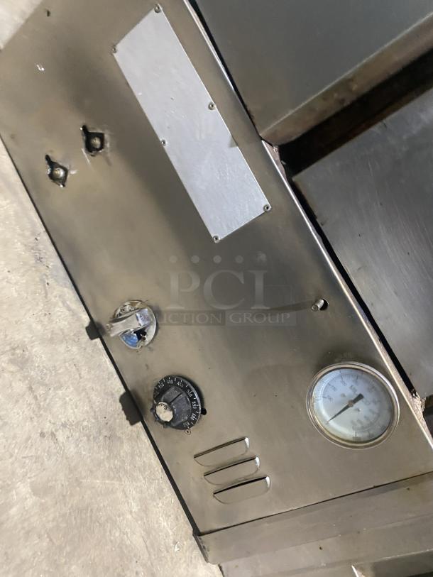 Commercial stainless steel double stacked convection oven, Model 648 M. Features dial, gauge, distinctive SN: 2268. Used condition.