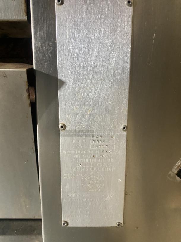 Commercial stainless steel double-stacked convection oven, Model 648 M, SN: 2268. Tag shows technical specs. Gas-powered.