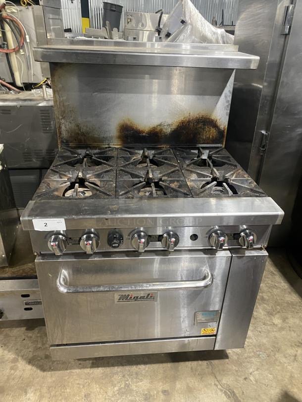 Migali commercial gas stove, 6 burners, stainless steel, model C-RO6B-NG, with oven, backsplash, salamander shelf, on casters.