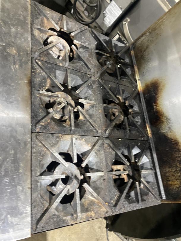 Migali Commercial 6-burner gas stove, model CRO6B, stainless steel with raised backsplash, salamander shelf, and oven.