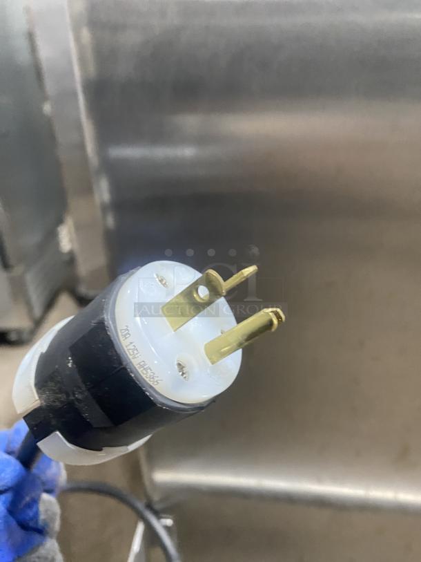 Winston stainless steel mobile cabinet, Model HOV514UVE, 120V 1 Phase, on casters, with a visible sturdy plug.