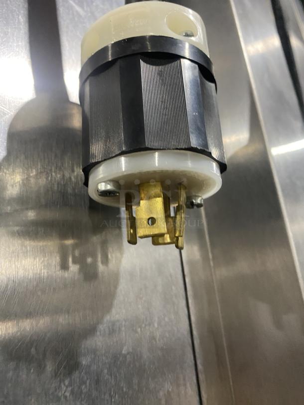 Traulsen RBC100 commercial stainless steel blast chill freezer plug detail, model serial T09031K05, 208-230V, on casters.