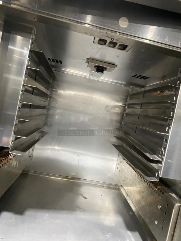 Victory UltraSpec stainless steel refrigerator interior, model HRSA-1D-S1EWHDSPEC183, on casters, shelving slots visible.