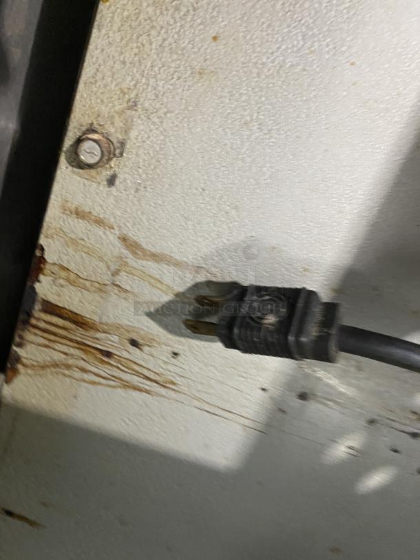 Power cord of Southbend Marathoner Gold Series convection oven, showing plug and part of unit's surface with minor stains.