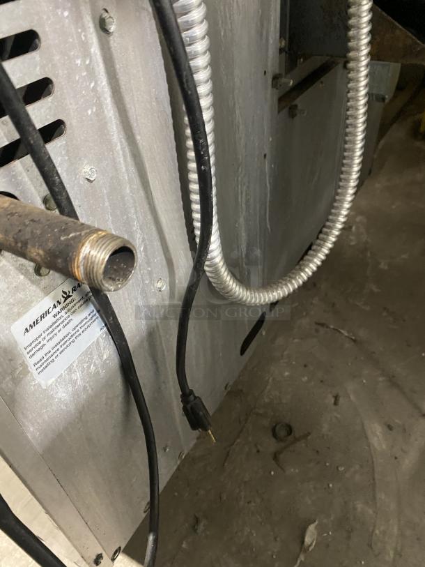 American Range Majestic Series stainless steel convection oven, single stack, with wired racks and American Range label visible.