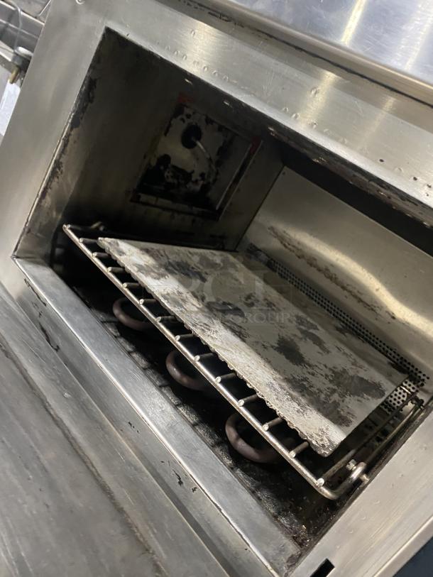 Amana AXP22 commercial stainless steel countertop microwave oven, visible wear, model and serial number engraved, 208-230V.